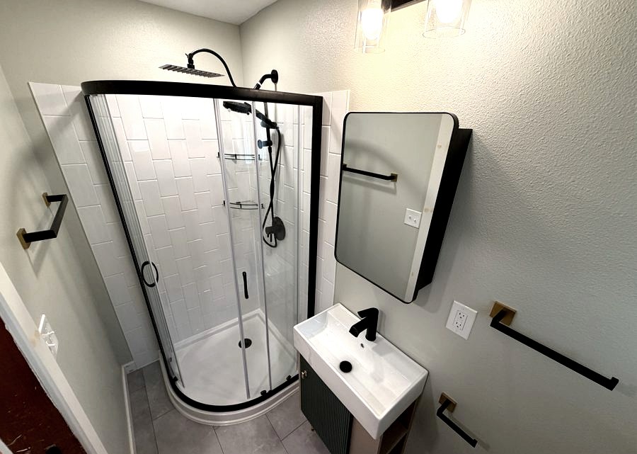Compact bathroom renovation with round shower