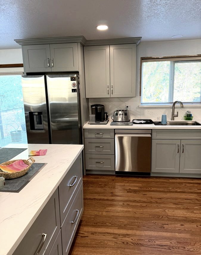 Custom kitchen island with quartz countertop by DA Interior Solutions
